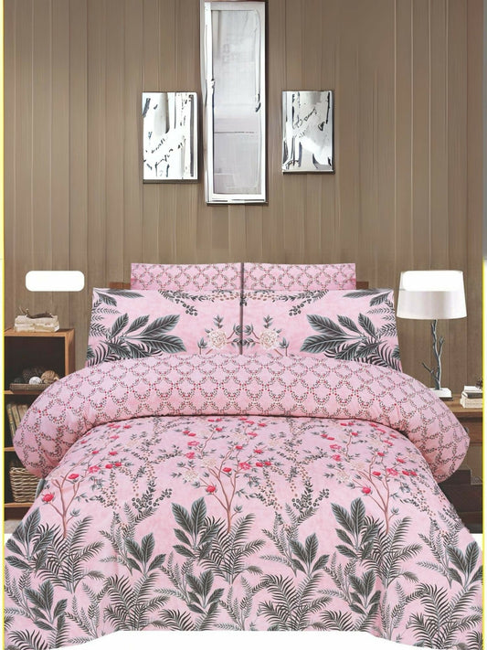 Light pink bedsheet with leafy and floral design, paired with matching pillow covers, styled neatly on a bed.