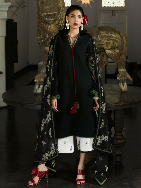 Jet black textured jacquard lawn shirt with tassel-detailed sleeves, ivory cotton culottes with black embroidery, and black lawn dupatta with ivory embroidered accents.