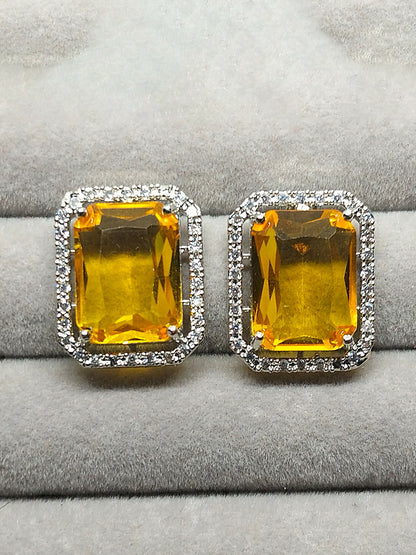 H&A Jewellery stud earrings with rectangular yellow stones surrounded by zircon accents.