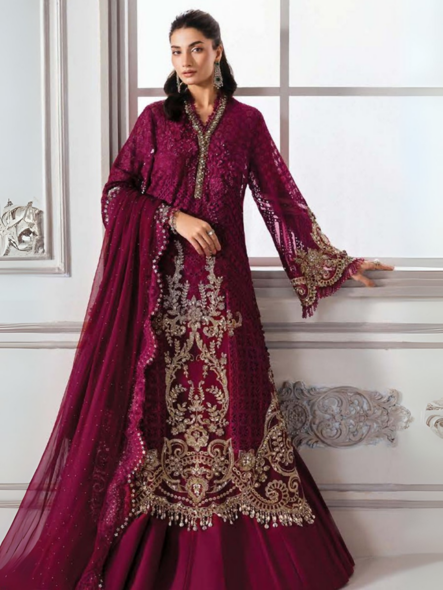 Woman wearing a 3-piece unstitched luxury chiffon suit with intricate embroidery, 3D flowers, hand embellishments, raw silk trouser, and a chiffon dupatta with diamantes.
