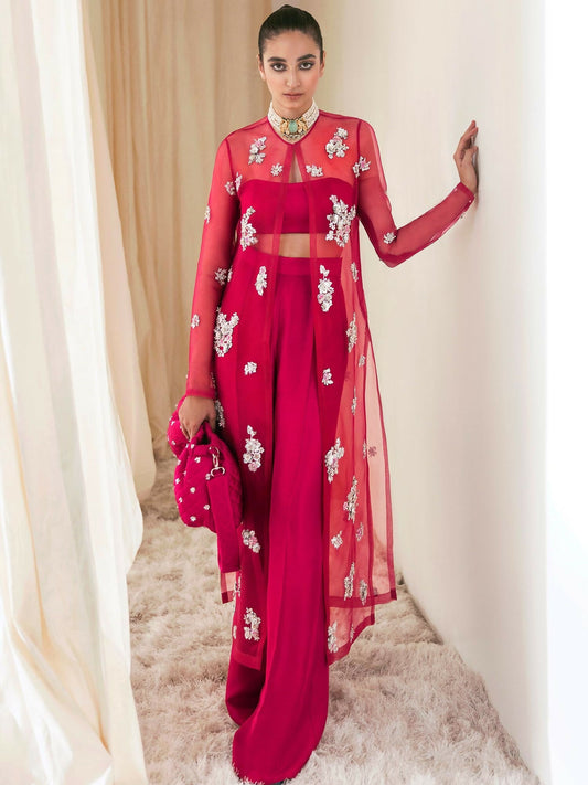 Hussain Rehar hot pink organza jacket with floral embellishments, paired with raw silk palazzo pants and satin slip.