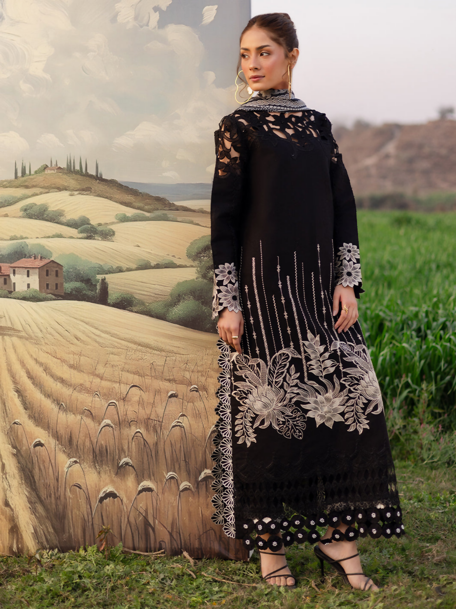 Unstitched 3-piece embroidered suit with detailed embroidered lawn shirt, dyed cambric trouser, and printed silk dupatta.