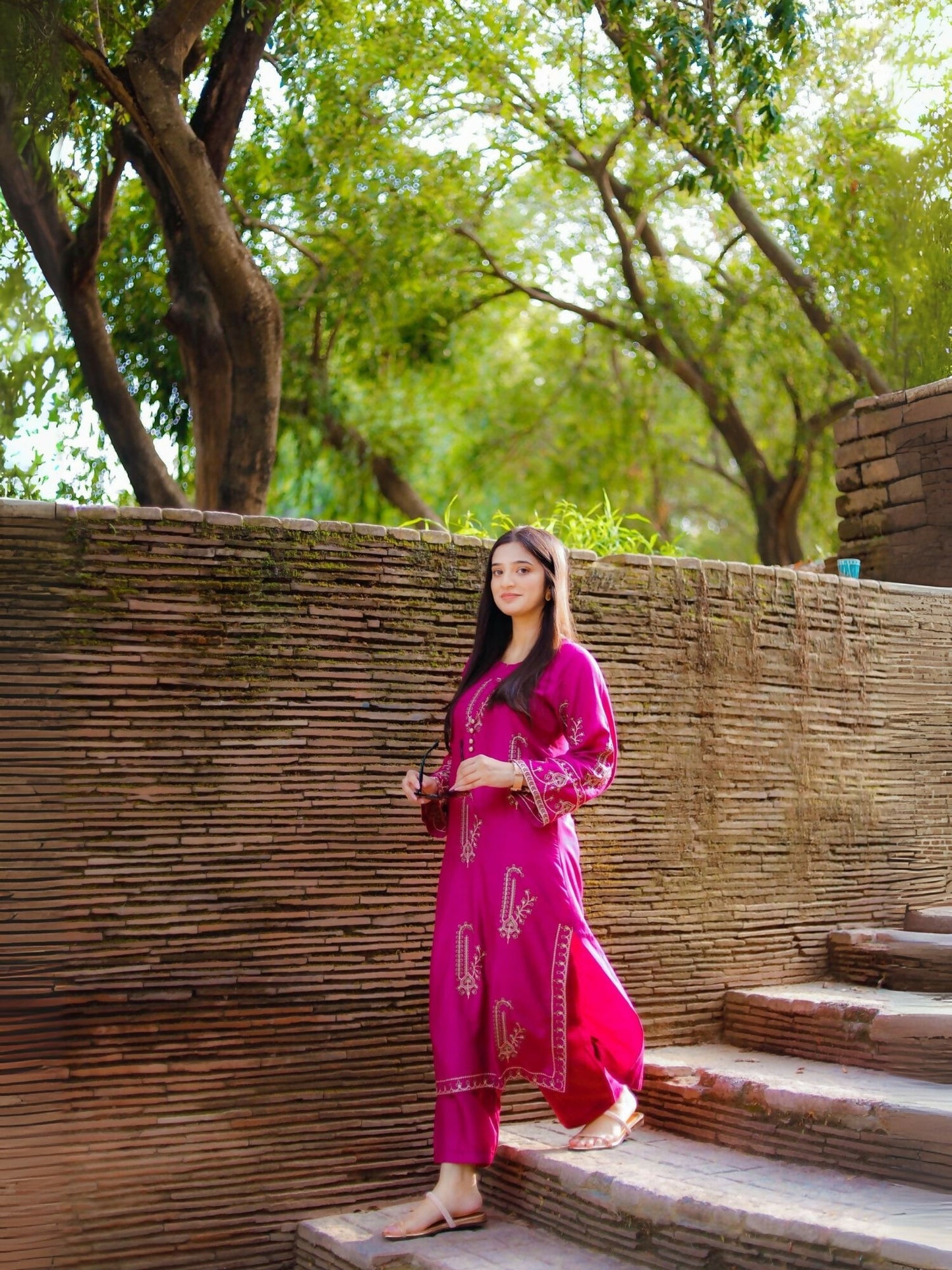 Stitched 2-piece suit with heavily embroidered summer lilen shirt and plain trouser from Tehzeeb Libas.