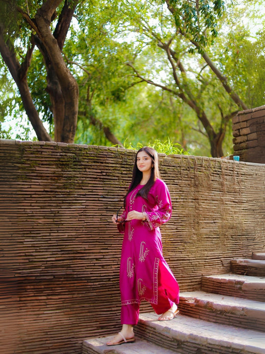 Stitched 2-piece suit with heavily embroidered summer lilen shirt and plain trouser from Tehzeeb Libas.