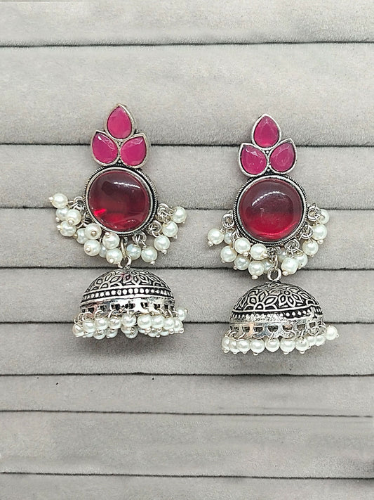 H&A Jewellery oxidized silver dome-shaped jhumka earrings with pink stones and pearl drops