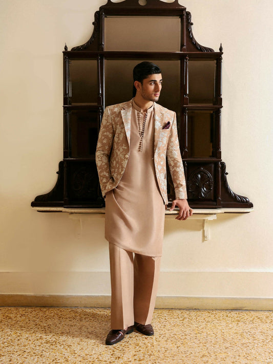 Hussain Rehar warm beige raw silk three-piece ensemble with embroidered floral blazer, loop-button kurta, and straight trousers.