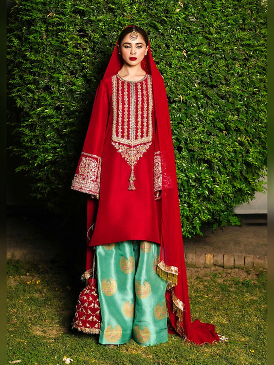 Unstitched 3-piece suit by Hussain Rehar featuring an embellished raw silk shirt with bead, dabka, and sequins work, paired with a screen-printed shalwar and chiffon dupatta finished with kiran and golden hangings.