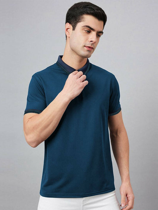 A man wearing a navy Jupiter zip neck workout polo, showcasing its moisture-wicking fabric and athletic fit.