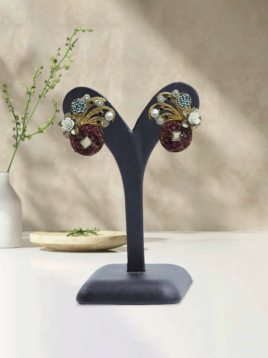 Glitter Jewellery floral stud earrings with textured circle base and decorative accents