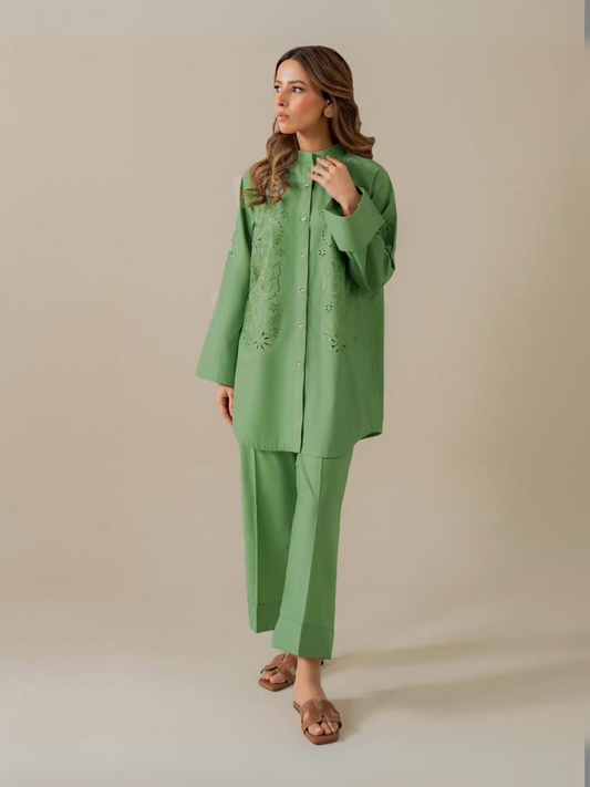 Trends Forever Karam Collection green lawn stitched 2-piece suit with embroidered shirt and plain shalwar, displayed in a soft studio light.