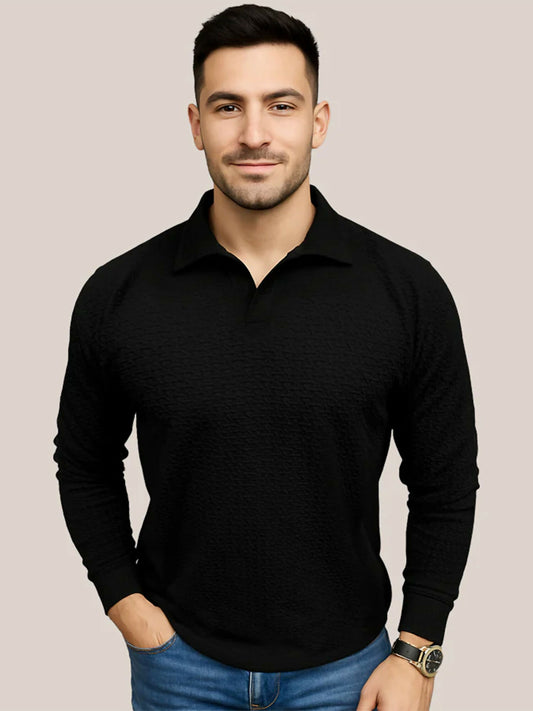 A man wearing a black Jupiter Self Textured Long Sleeve Polo featuring a Jhony open collar, ribbed cuffs, and a premium knit fabric with a subtle textured finish for a refined yet casual look