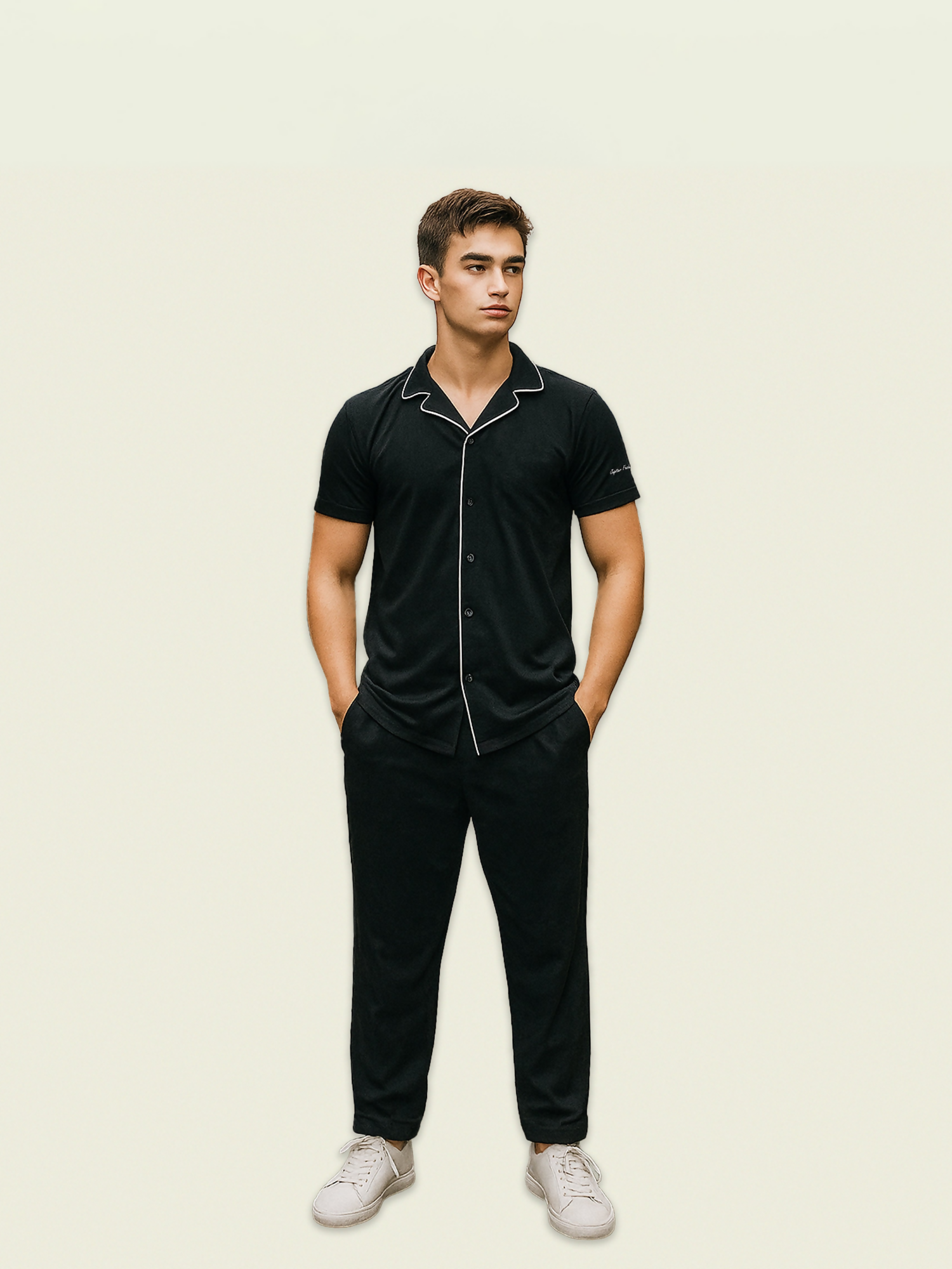 Unisex black coord set made from French pique fabric with white contrast lining, featuring drawstring waist and side pockets.