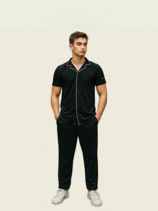 Unisex black coord set made from French pique fabric with white contrast lining, featuring drawstring waist and side pockets.