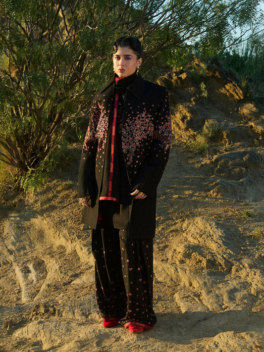 Jugnu by Hussain Rehar black floral embroidered Karandi trench coat with structured collar and straight embroidered sleeves