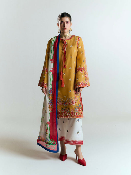 Mustard yellow cotton shirt with vibrant multicolor floral embroidery and digitally printed trims, wide embroidered sleeves, ivory embroidered culottes, and digitally printed silk dupatta with rich botanical motifs.