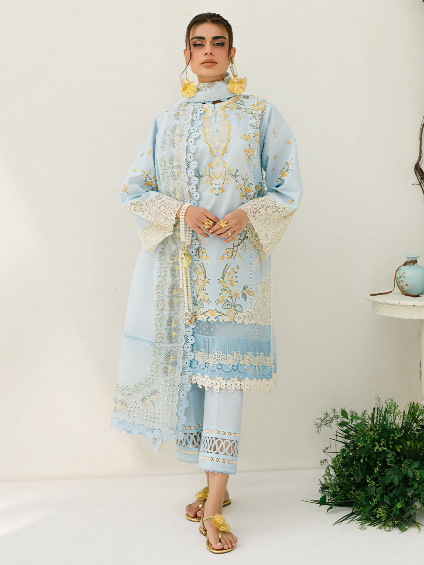 Embroidered lawn suit with multi-panel front, organza lace detailing, and an embellished dupatta paired with cotton trouser.