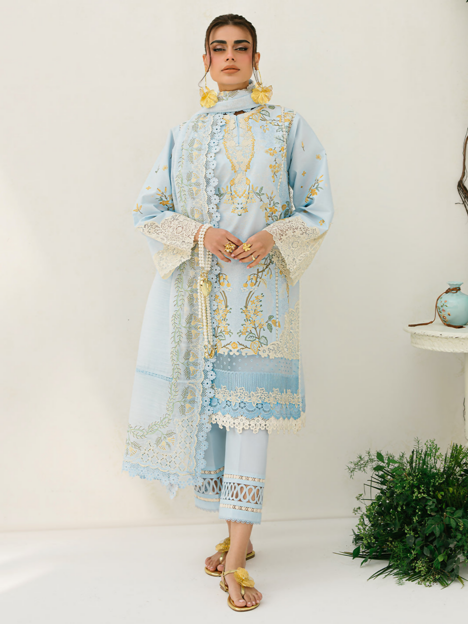 Embroidered lawn suit with multi-panel front, organza lace detailing, and an embellished dupatta paired with cotton trouser.