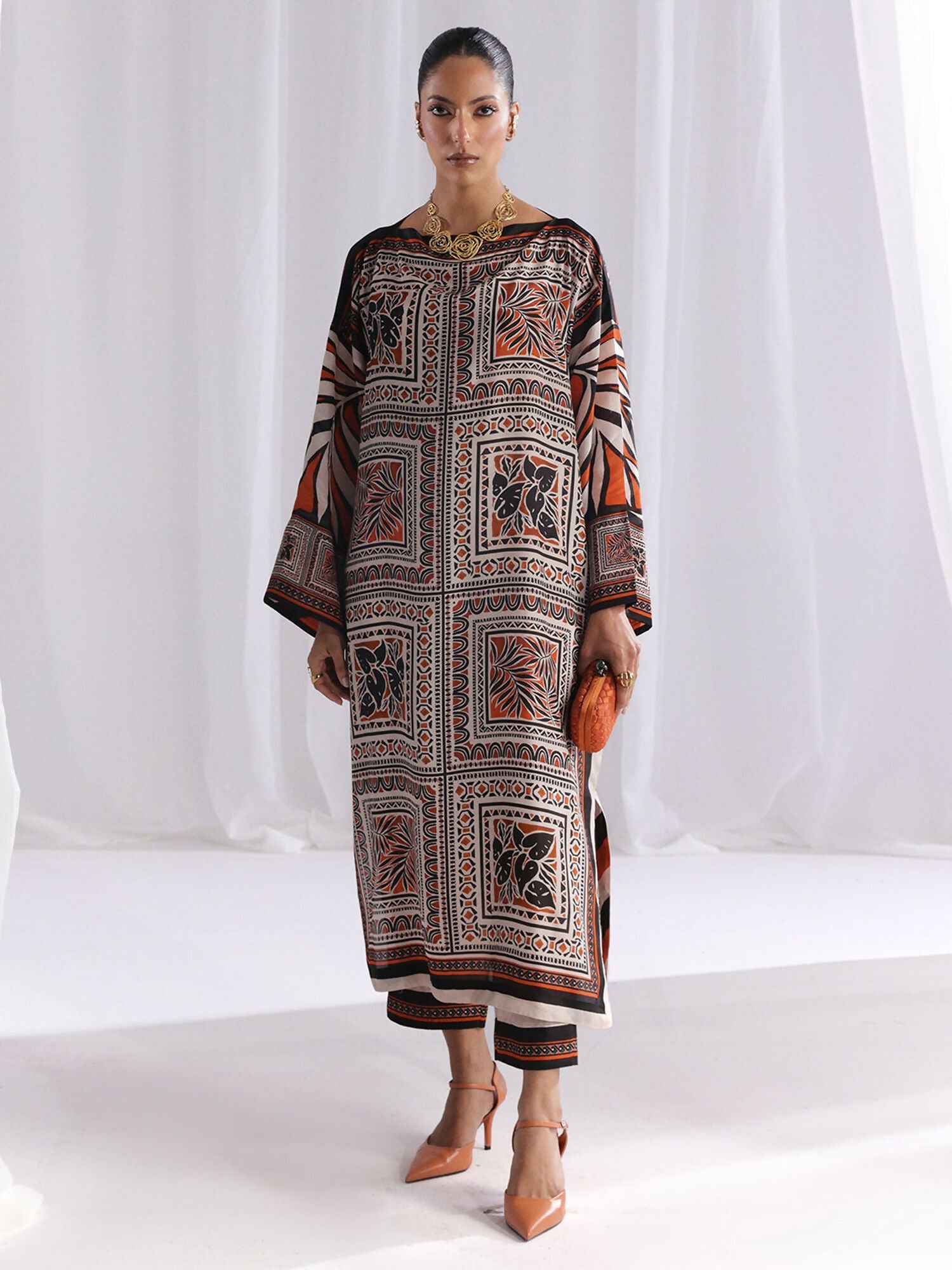 Unstitched digital printed silk 2-piece co-ord suit in orange and brown color by Bin Ilyas with matching shirt and trouser, stitched for a modern and elegant look.