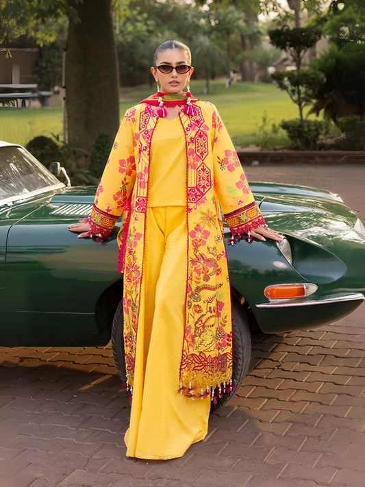 Woman wearing a yellow unstitched 3 piece suit with pink floral chikankari embroidery, chiffon dupatta, and cotton trouser.