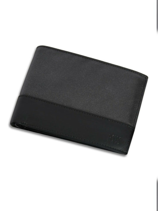 Men’s bi-fold leather wallet in contrast charcoal finish with ID flap, card slots, and cash compartments – soft and compact design