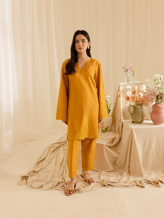Mahnur stitched 2-piece pret suit featuring an embroidered shirt paired with an embroidered trouser.