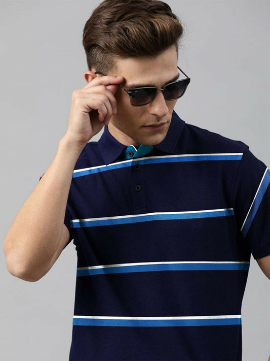 A man wearing a striped cotton jersey polo in a slim fit, featuring a tailored collar and a soft, comfortable texture.