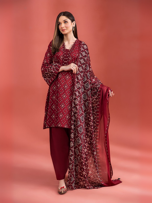 Nishat unstitched 3-piece lawn suit with ethnic geometric design, voile dupatta, and cambric shalwar.