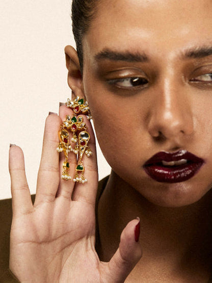 Jugnu by Hussain Rehar Lotus Cascade gold-tone earrings with floral motifs, green and red gemstone accents, cascading chains, and bead details, festive elegant accessory.