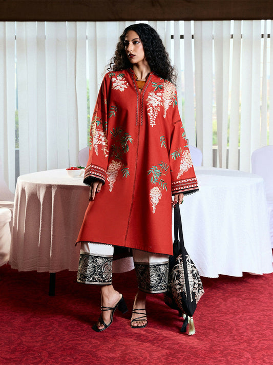 Rust cotton long shirt with multicolor floral embroidery, baggy sleeves with matching threadwork, light beige cotton culottes with monochrome traditional embroidery, and digitally printed chiffon dupatta.