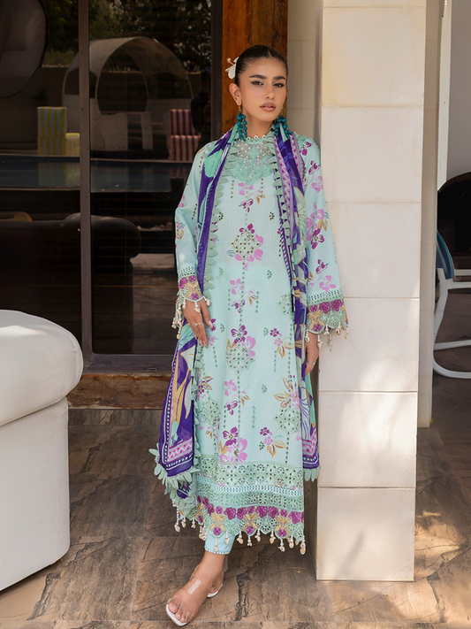 Woman wearing a sky blue unstitched 3 piece suit with colorful chikankari floral embroidery, chiffon dupatta, and cotton trouser.