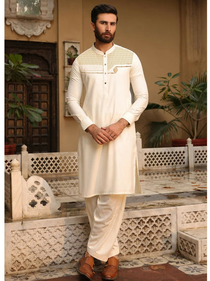 Cream-toned unstitched men’s kameez shalwar from Fabrich’s Monochrome Edit'25, featuring contrast chest embroidery in a signature pattern on soft wash n wear fabric.
