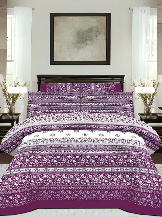 A mixed design bedsheet with magenta, purple, and white sections; white areas have magenta prints, and magenta pillow covers feature white floral patterns.