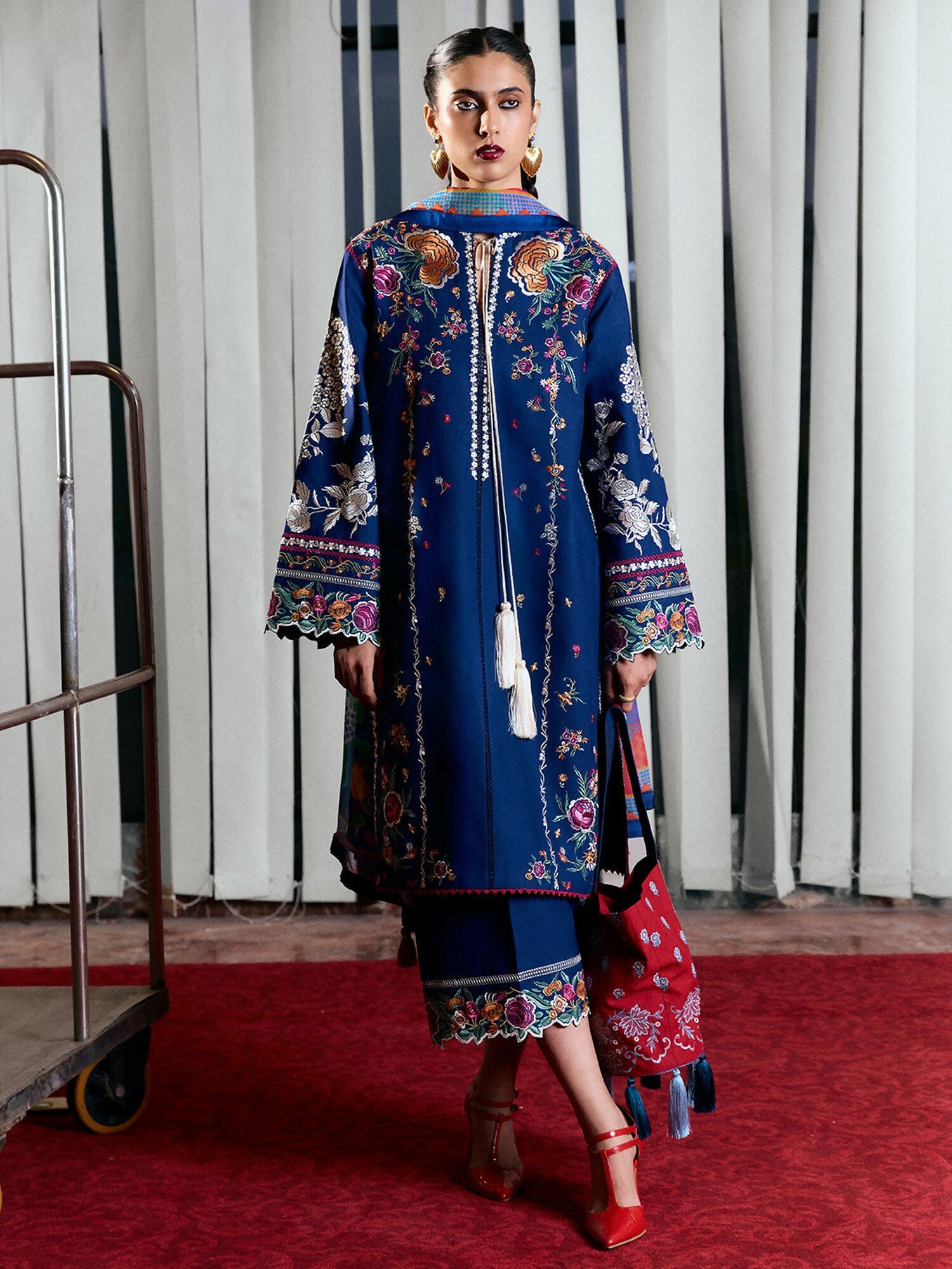Navy blue cotton long shirt with multicolor ghaara embroidery, tassel detail at the front, straight sleeves with cutwork, and wide-leg cotton culottes with matching embroidery and cutwork hem.