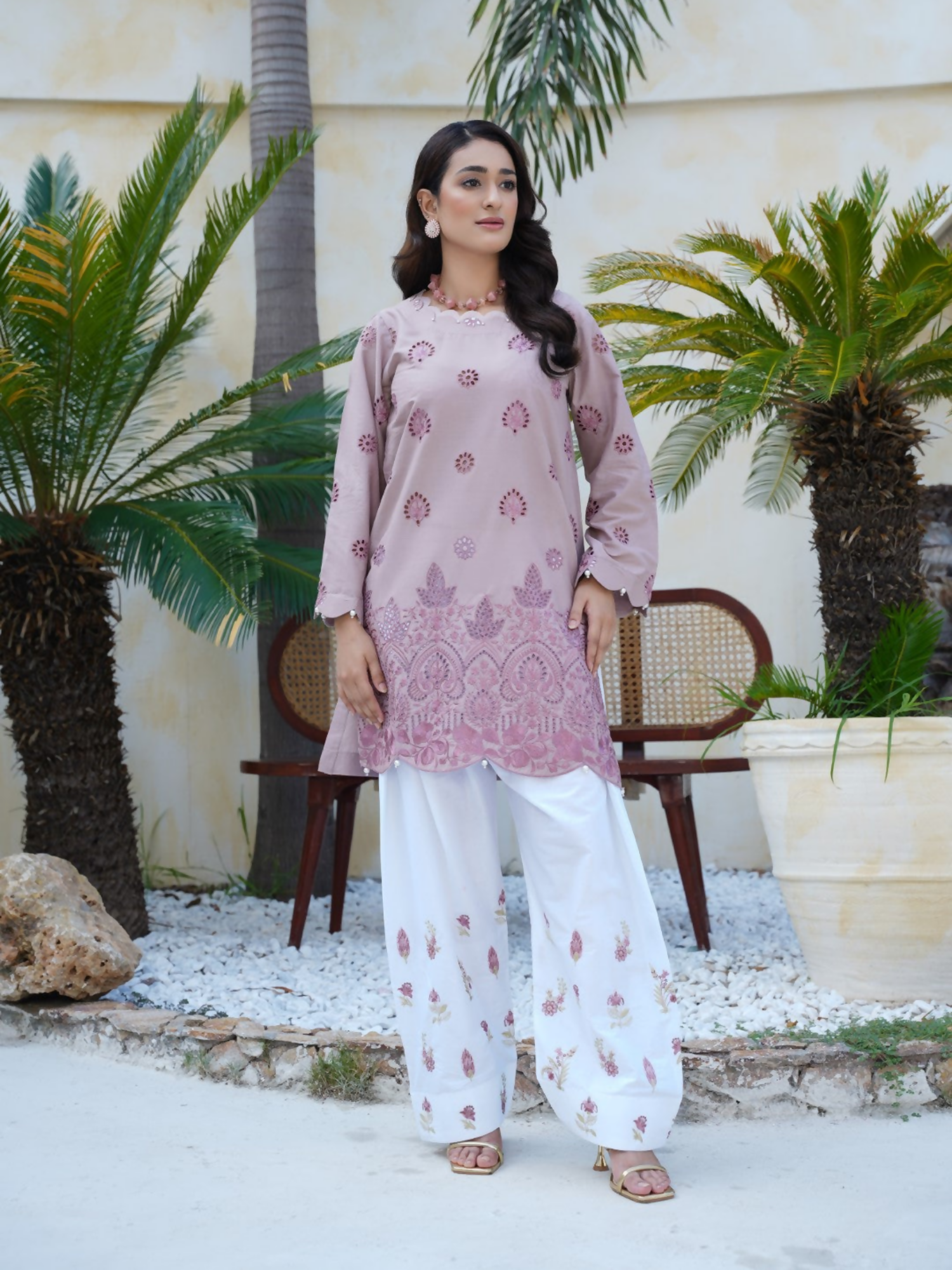 Girl wearing Trends Forever mauve lawn cotton embroidered kurta with maroon floral motifs and matching shalwar; stitched 2-piece suit.