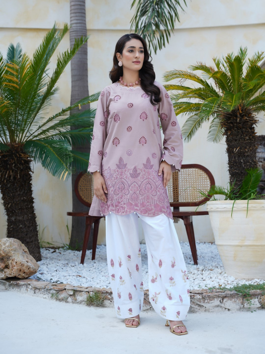 Girl wearing Trends Forever mauve lawn cotton embroidered kurta with maroon floral motifs and matching shalwar; stitched 2-piece suit.