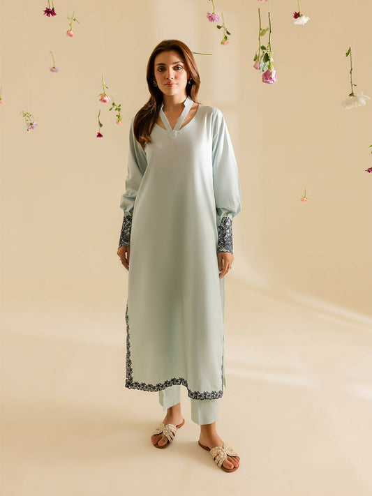 Mahnur stitched 2-piece pret suit featuring a lawn embroidered shirt with classic detailing, paired with a plain trouser.