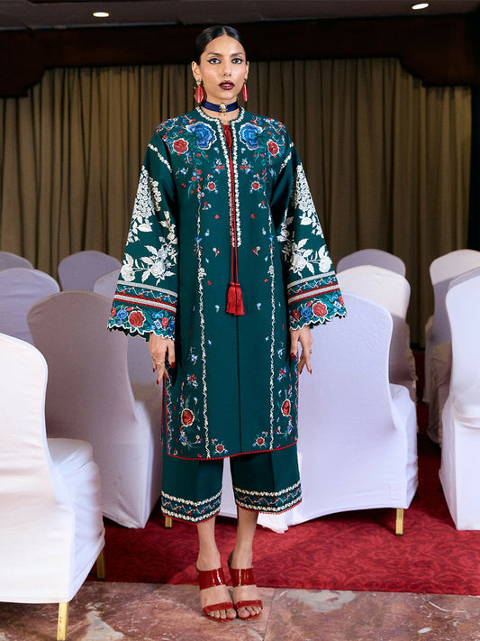 Emerald green cotton long shirt with multicolor ghaara embroidery, tassels, straight sleeves with cutwork, and wide-leg cotton culottes with matching embroidery.
