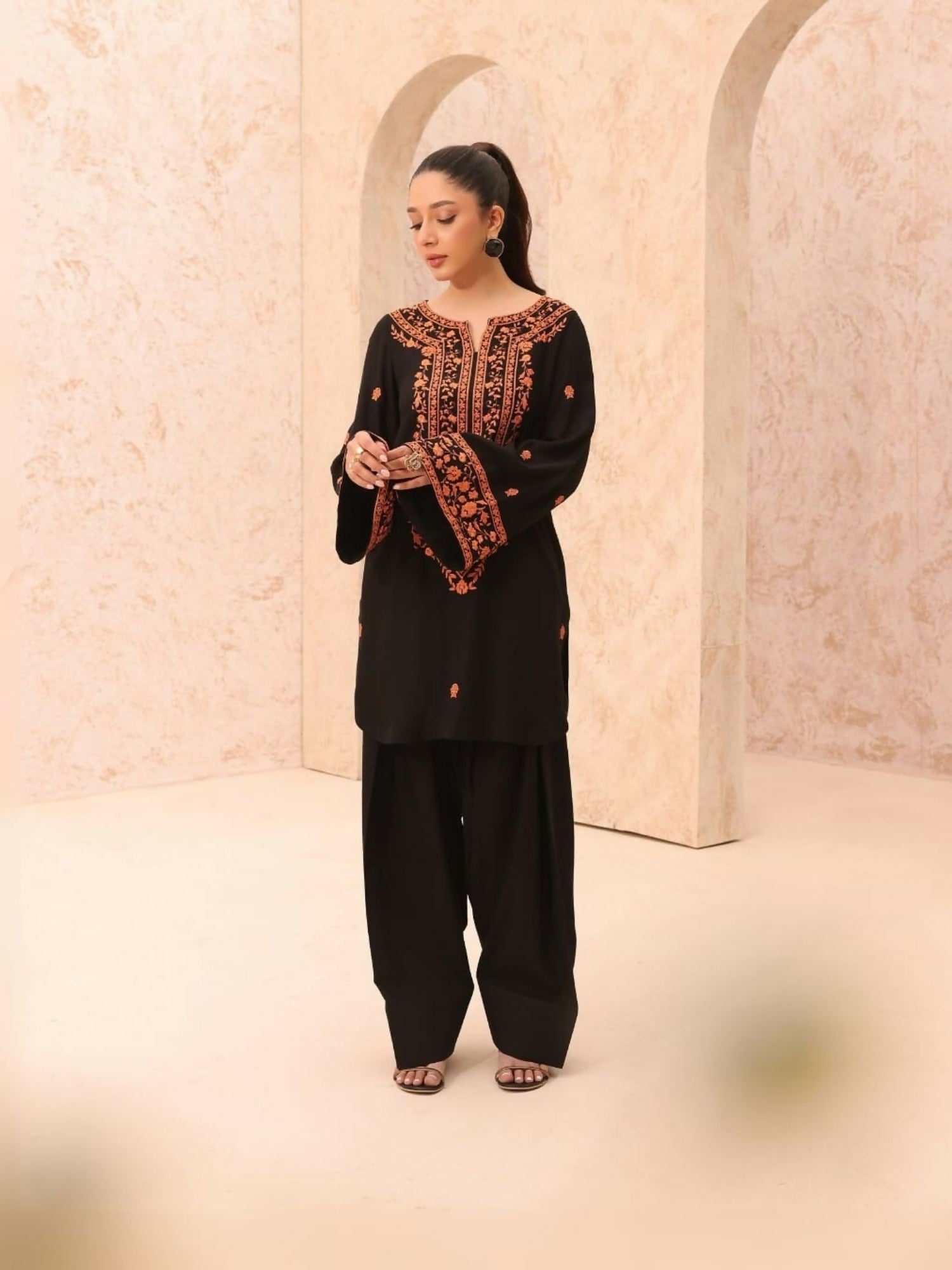 Tehzeeb Libas stitched 2-piece summer lilen suit with long embroidered neckline shirt and matching embroidered plazo.