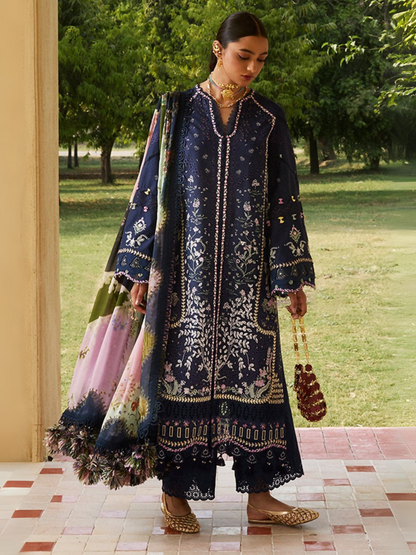 Deep blue embroidered lawn ensemble by Sana Yasir with organza details, digital printed dupatta, and cambric trouser.