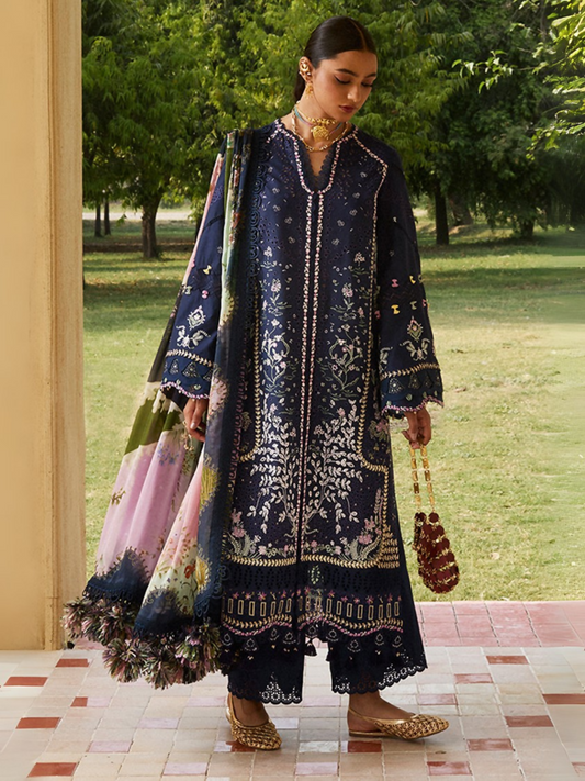 Deep blue embroidered lawn ensemble by Sana Yasir with organza details, digital printed dupatta, and cambric trouser.