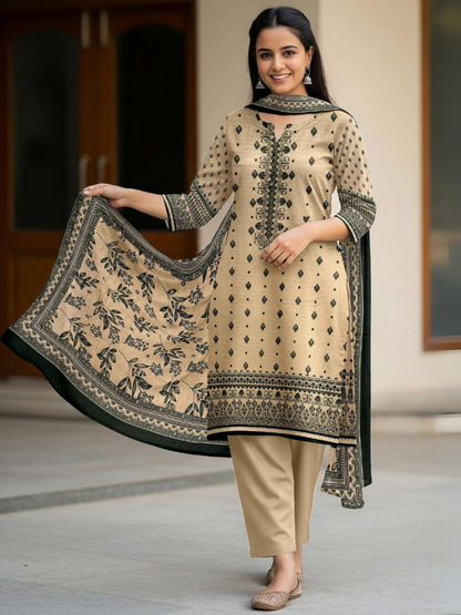 Woman in beige unstitched 3-piece suit featuring digital printed lawn shirt with green ethnic motifs, matching printed voile dupatta, and plain dyed trouser.
