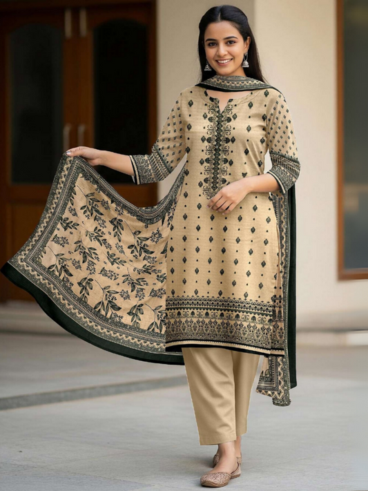 Woman in beige unstitched 3-piece suit featuring digital printed lawn shirt with green ethnic motifs, matching printed voile dupatta, and plain dyed trouser.
