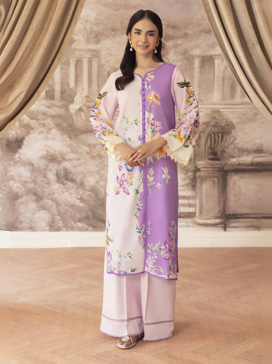 Woman wearing a light pink and lavender printed unstitched 2 piece lawn suit with colorful floral shirt and light pink trouser.