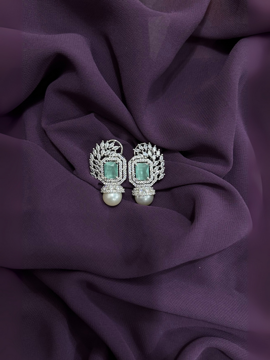 Mint green crystal and pearl drop earrings with silver-toned setting and clear crystal accents.