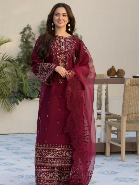 Tehzeeb Libas stitched 3-piece deep maroon suit with gold embroidered shirt and trousers, paired with floral embroidered organza dupatta.