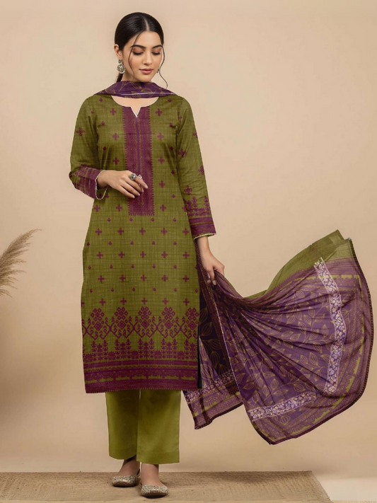 Woman in olive green and purple unstitched 3-piece suit featuring digital printed lawn shirt with traditional motifs, matching printed voile dupatta, and plain dyed trouser.