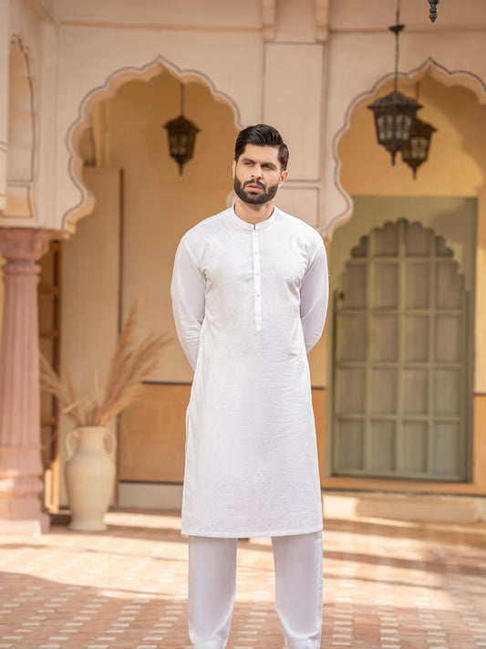 Off-white men’s unstitched kameez shalwar from the Miraas Collection by Fabrich, made from luxury soft fine 100% cotton, featuring allover cotton-thread embroidery with signature pattern and design — complemented with designer buttons and branded add-ons.