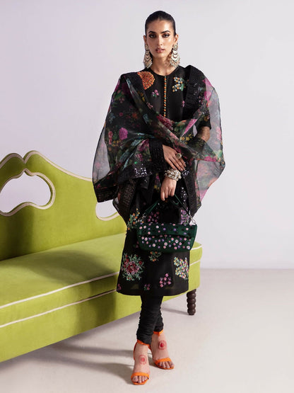 Hussain Rehar stitched 3-piece suit featuring a black raw silk embellished shirt with multicolored sequins and bugle beads, paired with raw silk churidar pajama and printed organza dupatta.