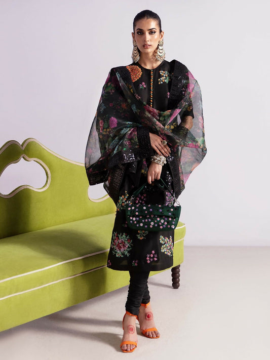 Hussain Rehar stitched 3-piece suit featuring a black raw silk embellished shirt with multicolored sequins and bugle beads, paired with raw silk churidar pajama and printed organza dupatta.