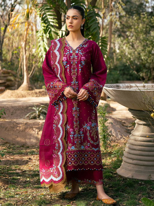 Woman wearing an unstitched deep maroon embroidered lawn outfit with floral motifs, detailed organza lace on sleeves and daman, paired with an embroidered fancy cotton mix dupatta and dyed cotton trouser with lace.